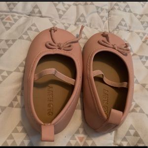 Pink slide on infants shoes